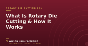 Wilson Manufacturing blog graphic titled 'What Is Rotary Die Cutting and How It Works' on a maroon background with a rotary cylinder ring motif.